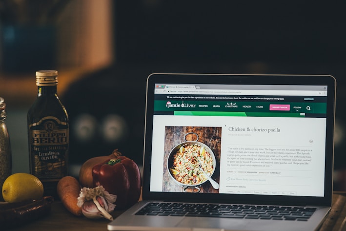 turned-on MacBook Pro on table